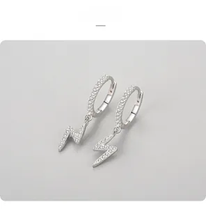 Close-up of 925 sterling silver lightning bolt hoop earrings with white zircon pavé