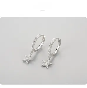 Macro shot of S925 sterling silver star hoop earrings with pavé set cubic zirconia