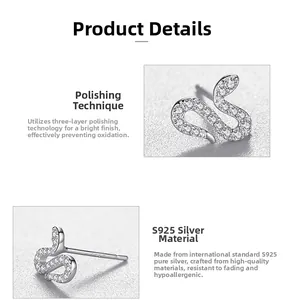 Macro shot of S925 sterling silver snake earrings featuring sparkling zirconia stones