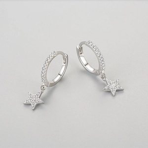 S925 sterling silver star drop earrings with micro-pave cubic zirconia on gray background