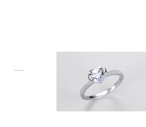 Detailed view of heart-shaped diamond ring with triple polished sterling silver band