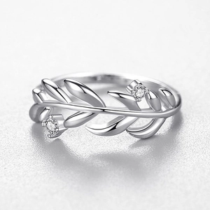 Minimalist S925 sterling silver leaf ring with pavé zircon accents on a clean white background