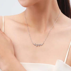 Elegant S925 sterling silver leaf necklace with sparkling zircons on a female model