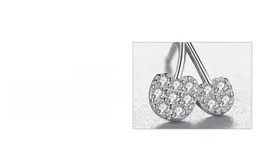 Macro detail of S925 sterling silver cherry stud earrings with hand-set cubic zirconia
