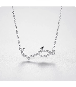 Detailed close-up of S925 silver necklace with micro-pave zircon Arabic love pendant