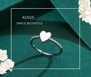 Detail of s925 sterling silver heart ring featuring sparkling zircon inlay and polished surface