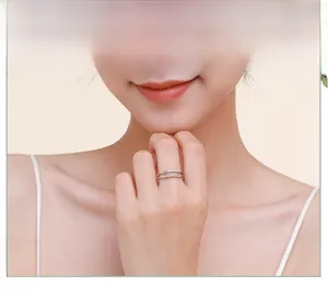 Double-layered S925 silver ring featuring micro-pave cubic zirconia on a model's finger