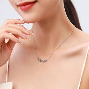 Elegant S925 sterling silver necklace featuring three sparkling daisy pendants on a chain