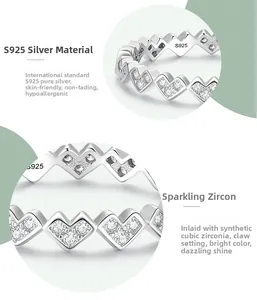 Detailed view of S925 sterling silver heart ring with claw-set cubic zirconia stones