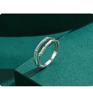Detail of s925 silver double-layered bamboo ring with pavé cubic zirconia setting