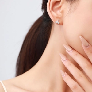 Sparkling s925 silver cherry stud earrings with pavé zircons on model ear