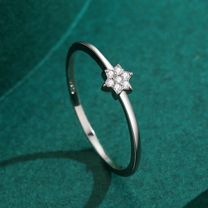 S925 sterling silver hexagon star ring with sparkling cubic zirconia on green velvet