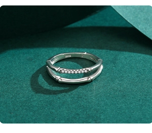 Macro detail of S925 sterling silver ring with bamboo joint texture and zircon setting