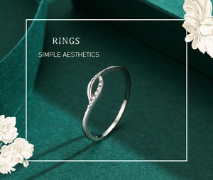 Macro shot of silver ring with elegant wave design and inlaid sparkling zircons