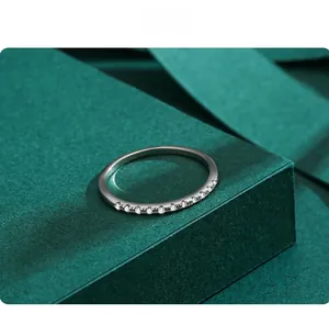 Close-up of a minimalist S925 sterling silver stackable ring with paved zircons