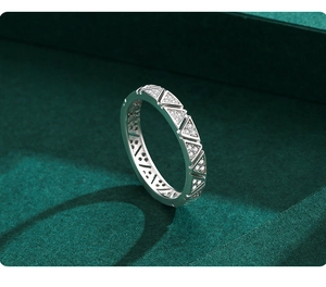 Detailed macro view of S925 sterling silver ring with micro-paved triangular zirconias