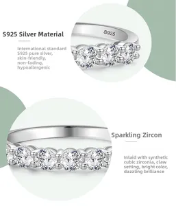 Macro shot of S925 sterling silver band showing prong-set cubic zirconia and hallmark