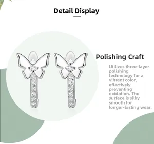 Detailed close-up of S925 sterling silver bow earrings with sparkling white cubic zirconia