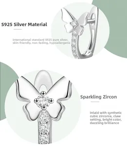 Macro shot of S925 sterling silver bow earrings with sparkling cubic zirconia settings
