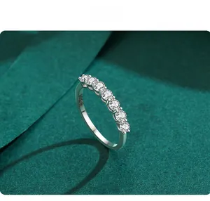 Close-up of S925 sterling silver ring featuring seven sparkling round-cut clear stones