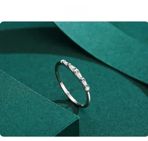 Macro shot of s925 silver geometric ring with baguette and round-cut cubic zirconia