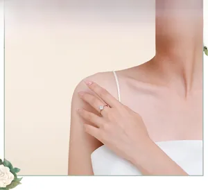 Close-up of elegant S925 sterling silver teardrop ring worn on a female model finger