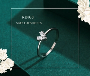 Detail of s925 silver ring featuring three sparkling heart-shaped zircon stones