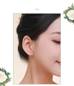 Close-up model view of elegant S925 silver pineapple stud earrings with sparkling crystals