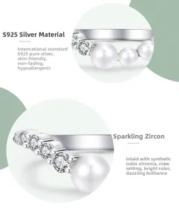 Detailed view of S925 silver V-shaped ring with pearl and prong-set zirconia accents