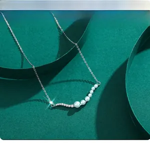 Close-up of elegant S925 silver necklace with pearls and sparkling diamonds