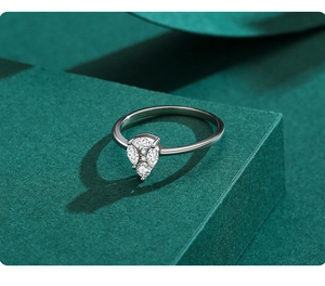 Macro detail of S925 sterling silver pear-shaped ring with micro-pave white zircon