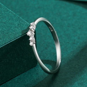S925 sterling silver geometric ring with five cubic zirconia stones on green stand