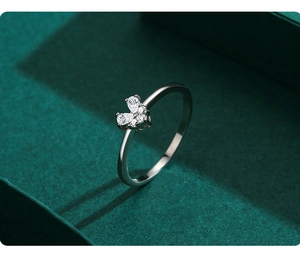 Macro shot of S925 silver heart ring featuring sparkling pear-cut cubic zirconia stones