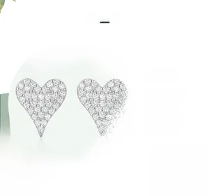Detailed macro view of S925 sterling silver heart earrings with full diamond pavé setting