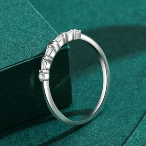 S925 sterling silver geometric ring with baguette and round cut diamonds on green stand