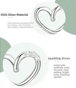 Detailed close-up of S925 sterling silver heart earrings with prong-set cubic zirconia