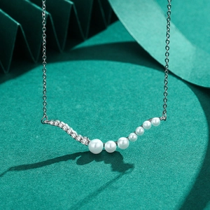 Elegant S925 silver necklace with wavy pearl pendant and sparkling cubic zirconia stones