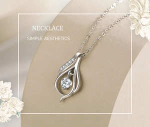 Detail of s925 silver necklace featuring a teardrop pendant and sparkling round diamond
