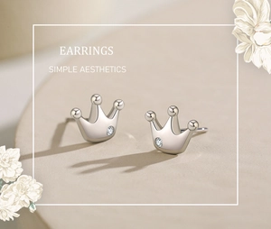 Detailed close-up of s925 silver crown stud earrings with round diamond accents