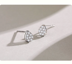Macro view of S925 sterling silver water drop stud earrings with pavé zircon stones