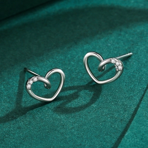 Elegant S925 sterling silver hollow heart earrings with inlaid cubic zirconia crystals