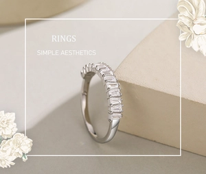 Close-up of S925 silver ring with baguette-cut diamonds on a minimalist stone base