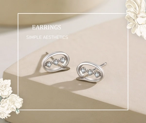 Detailed macro view of S925 silver speech bubble earrings with sparkling zircons