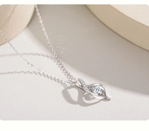 Detailed view of an S925 sterling silver necklace with a sparkling solitaire pendant