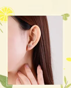 Macro view of S925 sterling silver speech bubble stud earrings with micro-set zircons