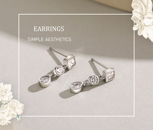 Vue détaillée de boucles d'oreilles en argent avec trois pierres aux coupes différentes