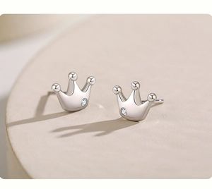 Macro side view of S925 sterling silver crown stud earrings with sparkling round stones