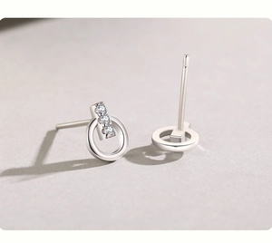 Detailed view of S925 sterling silver studs featuring geometric bars with inlaid diamonds