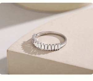 Macro detail of S925 sterling silver ring showing S925 hallmark and baguette-cut stones