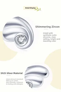 Detailed macro view of S925 sterling silver angel wing earring with cubic zirconia inlay